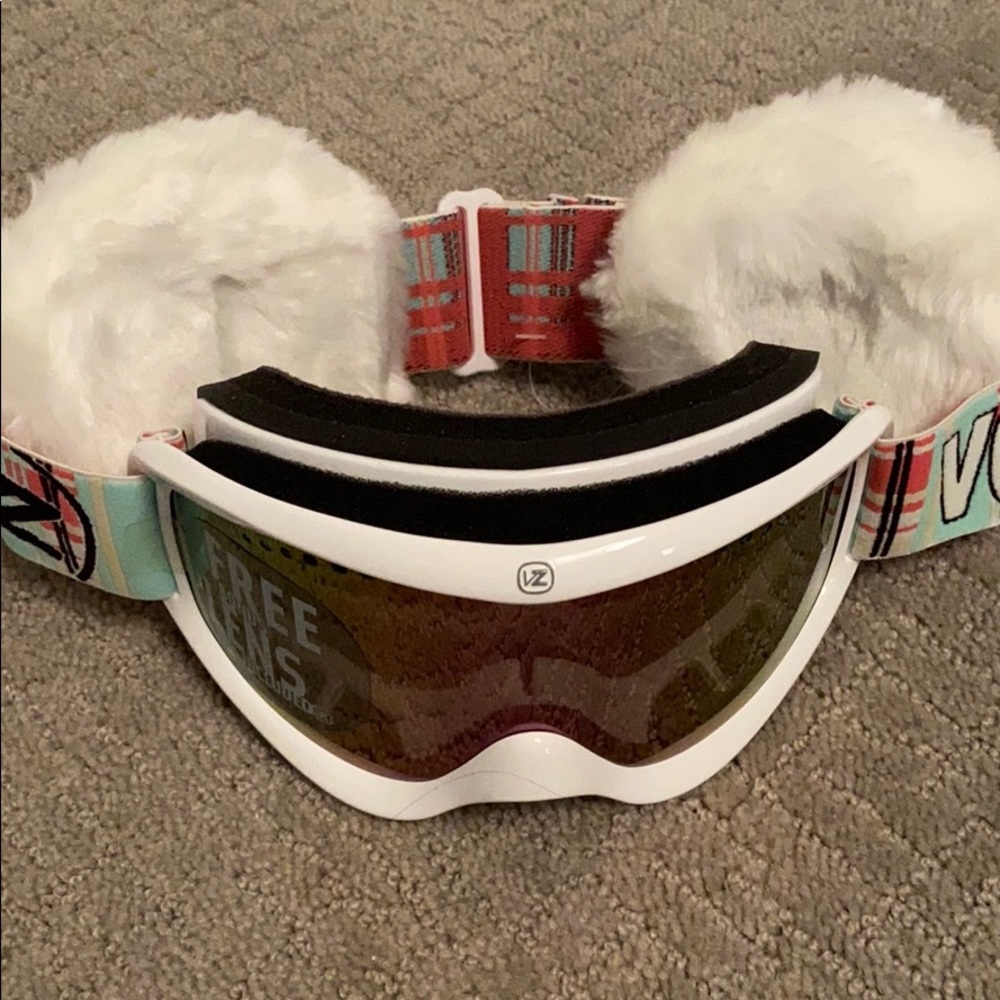 Snowboarding goggles and ear muffs